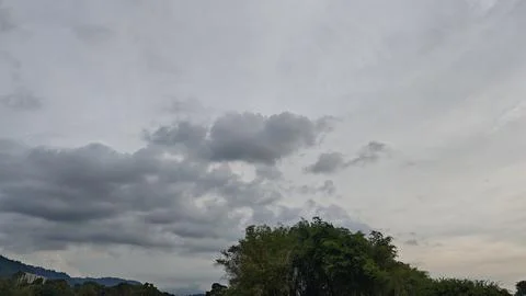 Cloudy Day: Soft Grey Clouds Filling the Sky Stock Photos