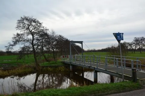 Cloudy day, view over aquatic farmland in Doezum, named doezumertocht near Stock Photos