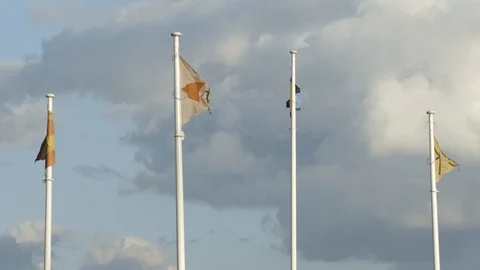 Cloudy day. Wavey flags. Slow motion 4k Stock Footage 127166924