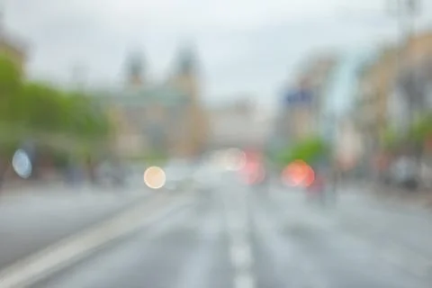 Cloudy defocused cityscape at evening Stock Photos