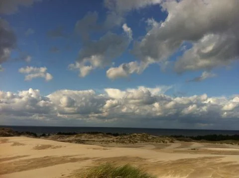 Cloudy dune Stock Photos