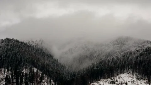Cloudy dynamic sky over mountain forests in winter. 4k timelapse. Stock Footage 79200649
