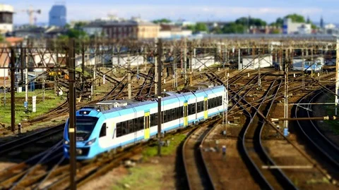 Cloudy evening rush of trains entering and leaving the station - miniature Stock Footage 78912425