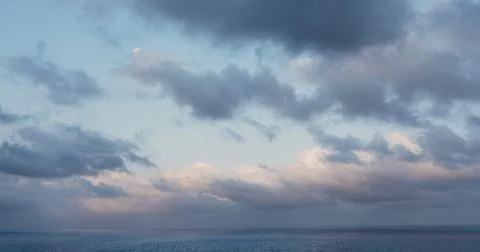 Cloudy evening sky. Sunset. Sun low over the horizon 写真素材