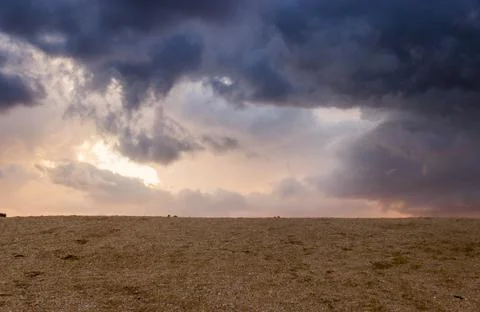 Cloudy evening sky under the sand of sea beach, Arabat Spit, Ukraine Stock Photos
