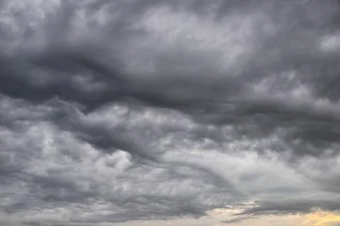 Cloudy gloomy sky background, dramatic low rainy clouds Stock Photos