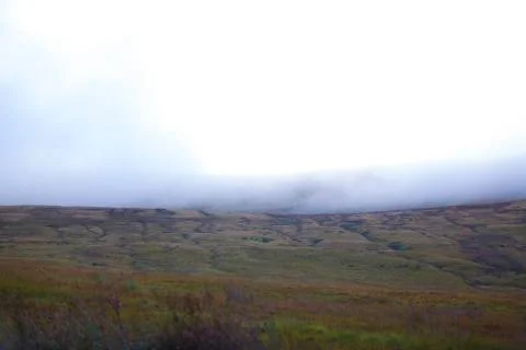 Cloudy hill  Stock Photos