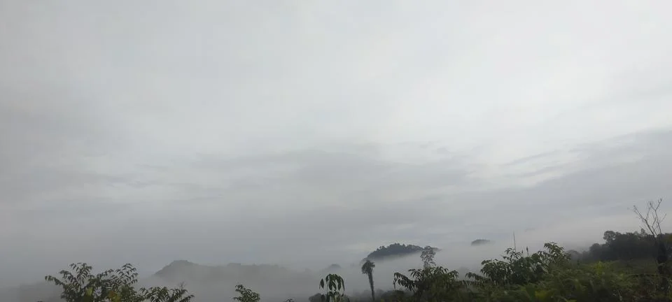 Cloudy hill Stock Photos