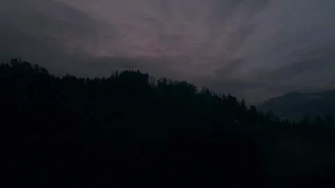 Cloudy hills under dramatic evening sky Stock Footage 328338082