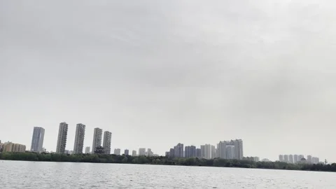 Cloudy Lakefront City Skyline 02 in China 4K Stock Footage 346218337