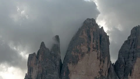 Cloudy, moody close-up time-lapse of Drei Zinnen, Dolomites with clouds in 4k. Stock Footage 214474405