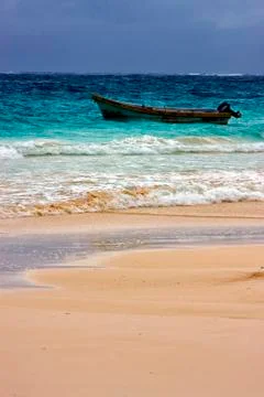 Cloudy  motor boat  boat  and coastline in mexico playa del carmen Stock Photos