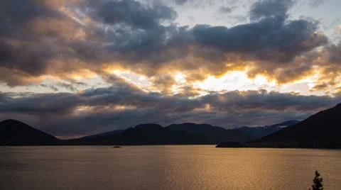 Cloudy mountain and ocean sunset Stock Footage 22916792