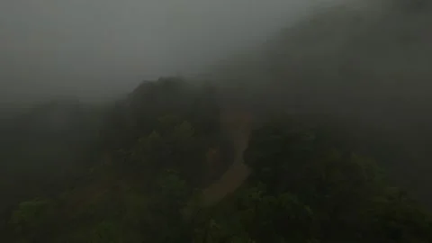 Cloudy mountain in jungle tropical forest flying over the road fpv 4k drone shot Stock Footage 171532136