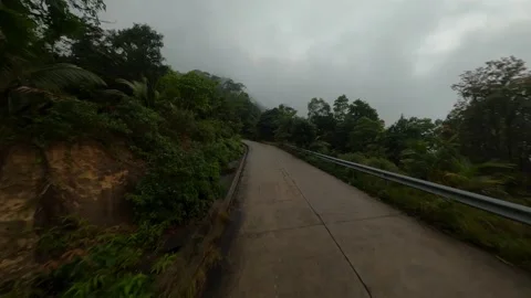 Cloudy mountain in jungle tropical forest flying over the road fpv 4k drone shot Stock Footage 171532156