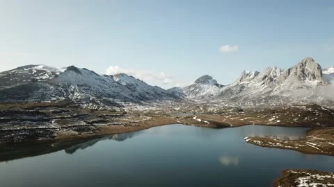 Cloudy mountain landscape with snow from a drone Stock Footage 142219394
