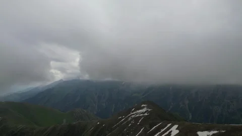 Cloudy mountain peaks in Trans-Ili Alatau range Stock Footage 345386456