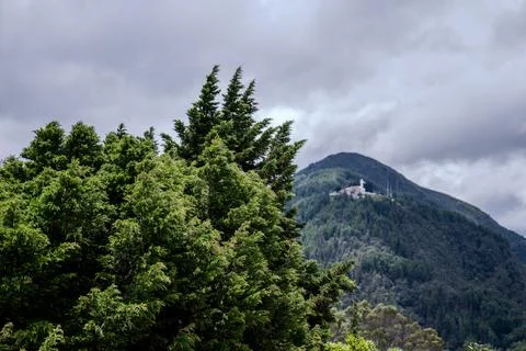 Cloudy mountain ridge with forest canopy above Bogota Stock Photos