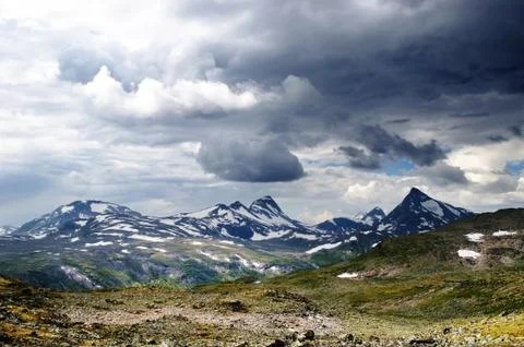 Cloudy mountain scenery Stock Photos