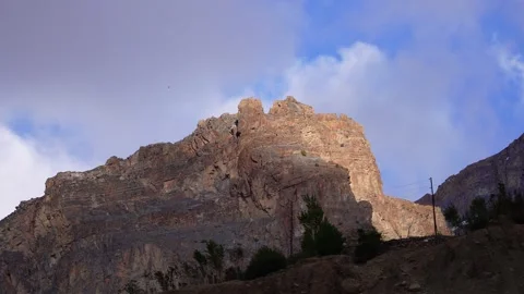 Cloudy Mountain View with Moving Clouds and Cloud Shadows Covering the Peaks Stock Footage 277284929