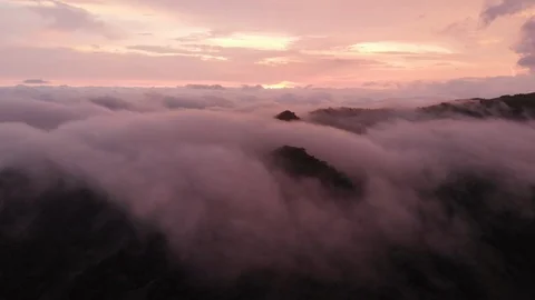 Cloudy mountains- monteverde - sunset over the clouds - aerial UHD Stock Footage