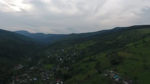 Cloudy in the Mountains , Mountain settlement, Aerial Drone View, 4k Stock Footage 147094681