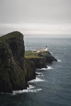Cloudy Neist Point Lighthouse at Isle of Skye, Scotland Stock Photos