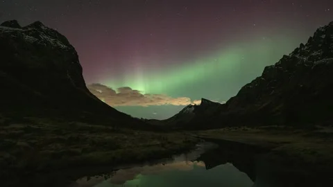 Cloudy night with aurora on the horizon Stock Footage 266921666