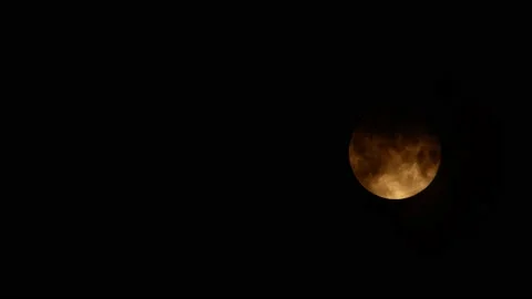 A cloudy night dark sky with large moon Stock Footage 205597884