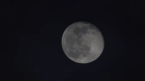 Cloudy night moon nearly full seen through refractor telescope at zenith Stock Footage 123196126
