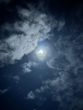 Cloudy night sky with moonlight Stock Photos