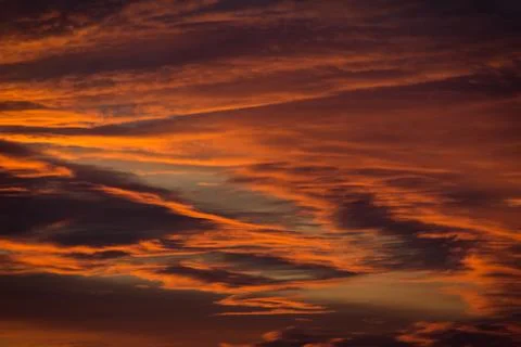 Cloudy orange sky in the sunset Stock Photos