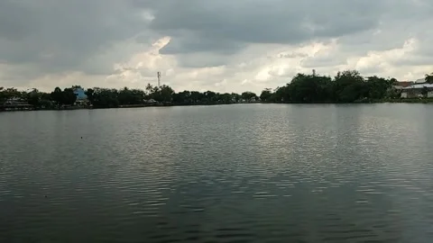 Cloudy over black lake Stock Footage 221395408