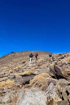 Cloudy over mountains on hiking trail to Mulhacen peak Stock Photos