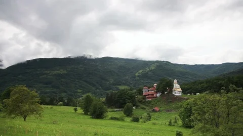 Cloudy panorama of the hill with monastery Видео 109173129