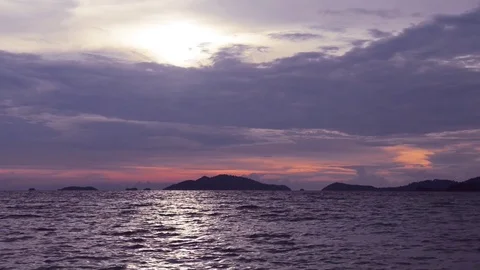 Cloudy rainy sunset above the dark sea waves Stock Footage 81056727