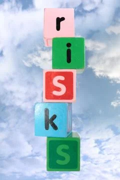 Cloudy risks in toy play block letters with clipping path Stock Photos