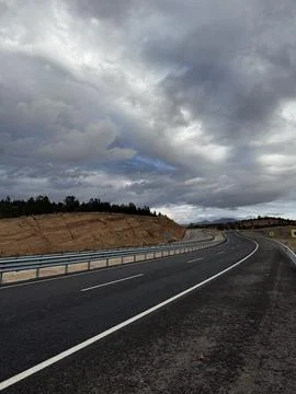 Cloudy road landscape Stock Photos
