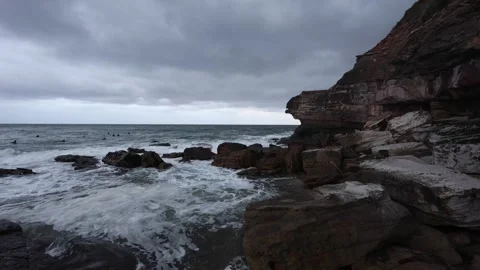 Cloudy rocky beach shore Stock Footage 264584060