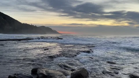 Cloudy rocky shore Stock Footage 243536175