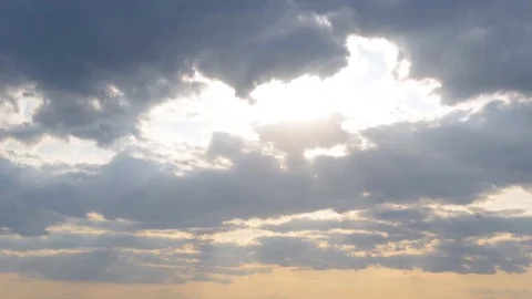 Cloudy scene with sunrays exiting the clouds Stock Footage 118816863