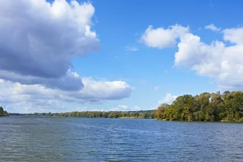 Cloudy scenery over the river Stock Photos