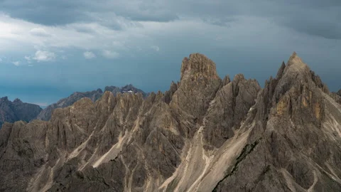 Cloudy scenic Sunset time-lapse of a rocky mountain in the Dolomites, Italy.  8k Stock Footage 247642961