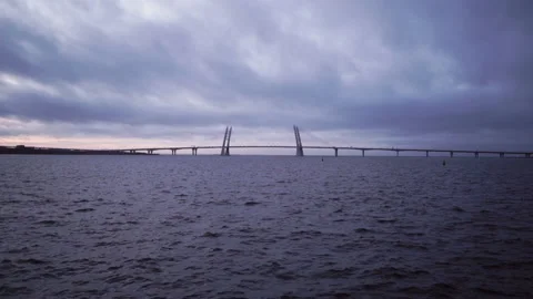 Cloudy sea and the bridge in the background. Foggy seascape. Cloudy dramatic Stock Footage 142624216