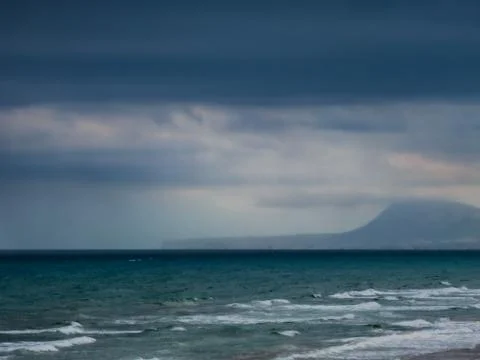 Cloudy seascape with the coast in the background Stock-Fotos