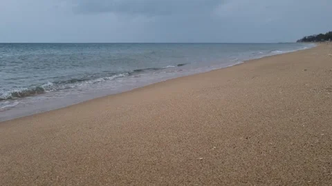 Cloudy Seashore with Rain and Gentle Surf in 4K UHD Stock Footage 318740868