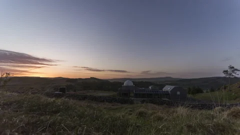 Cloudy skies over the observatory at sunset Video stock 131002895