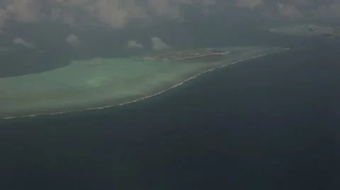 A cloudy sky above an Indian Ocean island Stock Footage 49365230