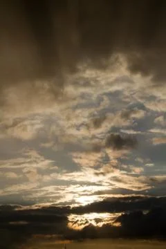 Cloudy sky in air with white clouds and sun Stock Photos