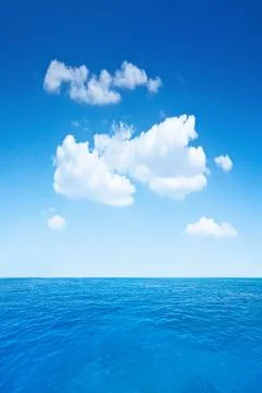 Cloudy sky and ocean Stock Photos